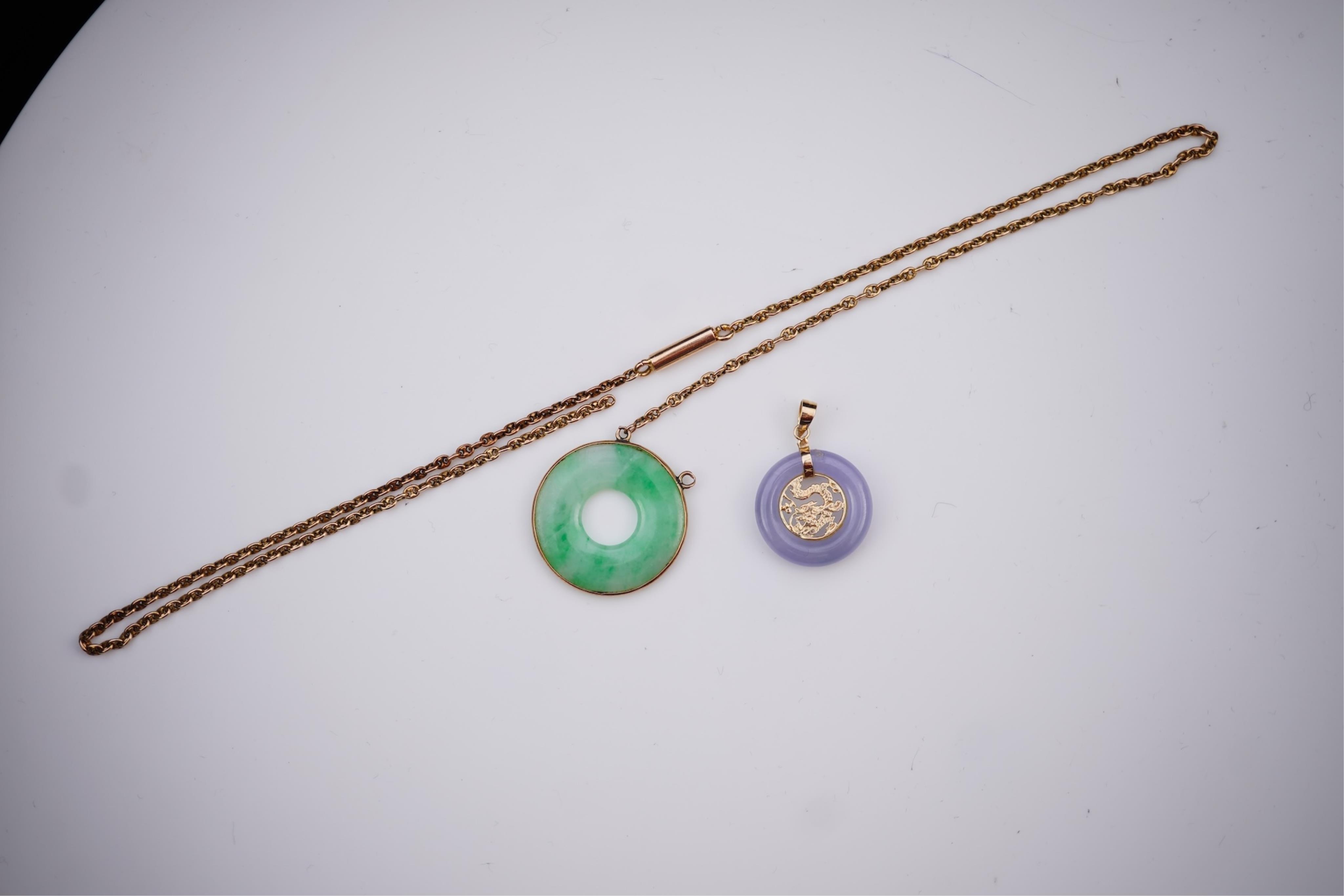 Two jadeite pendants